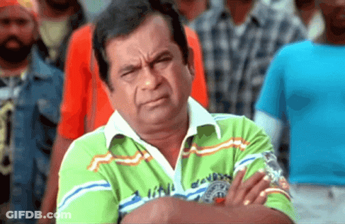 Man With Arms Crossed Wearing Green London Shirt GIF