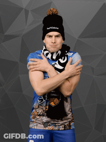 Man With Arms Crossed Wearing Scarf And Tuff Hat GIF