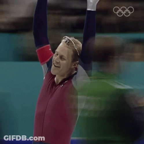 Man With Arms In Air In Red And Blue Outfit GIF