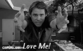 Man With Arms Outstretched And Love Me Sign GIF