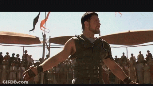 Man With Arms Outstretched In Front Of Crowd GIF