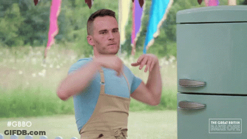 Man With Arms Outstretched In Front Of Green Refrigerator Saying Gbbo GIF
