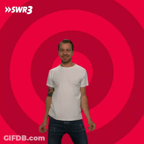 Man With Arms Outstretched In Front Of Red Circle GIF