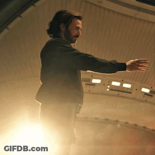 Man With Arms Outstretched In Room GIF