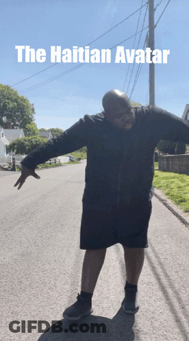 Man With Arms Outstretched On Roadside Caption The Haitian Avatar GIF