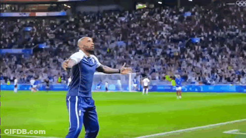 Man With Arms Outstretched On Soccer Field GIF