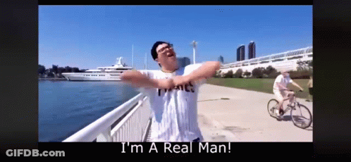 Man With Arms Outstretched Saying I'm A Real Man GIF