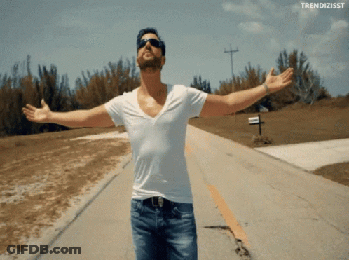 Man With Arms Outstretched Saying Trendizsst GIF