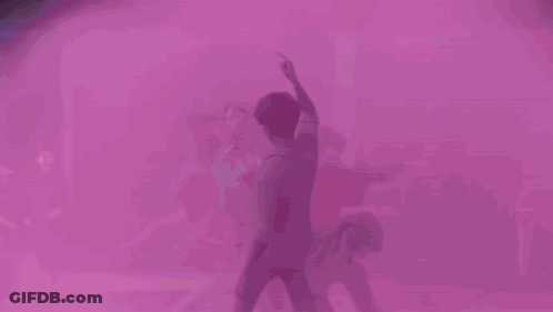 Man With Arms Outstretched Surrounded By Four Women GIF