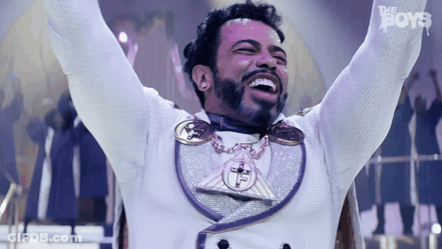 Man With Arms Up In White Purple Outfit Saying The Boys GIF
