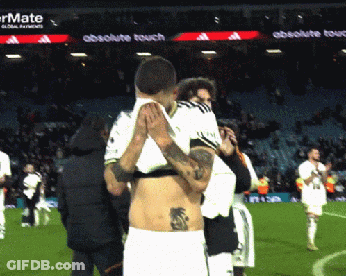Man With Back Tattoo Lifted By Another Man GIF