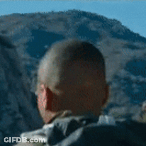 Man With Backpack In Front Of Mountain GIF