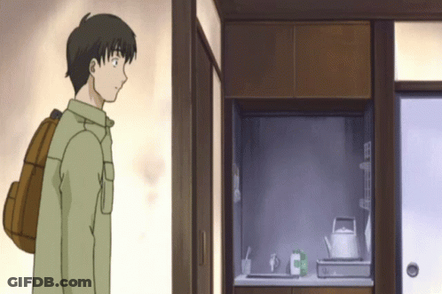 Man With Backpack In Kitchen GIF