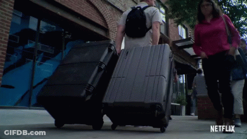 Man With Backpack Looking At Camera With Netflix Logo GIF