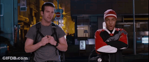 Man With Backpack Next To Man In Red And White Sweatshirt GIF