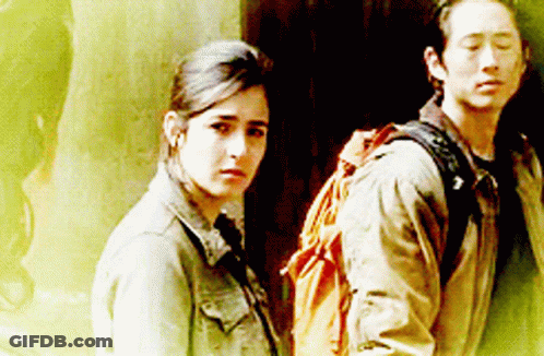 Man With Backpack Next To Woman GIF
