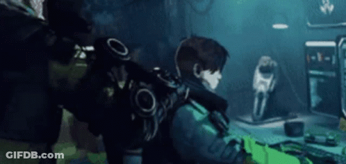 Man With Backpack Playing Video Game GIF