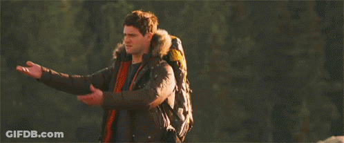 Man With Backpack Standing In Forest GIF