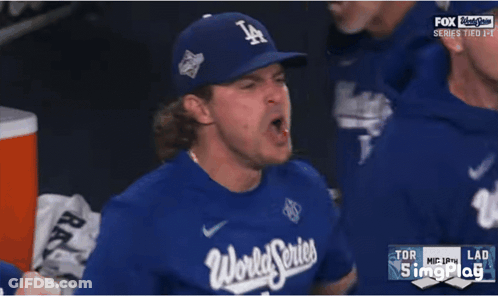 Man With Backpack Standing In Front Of Empty Seats GIF
