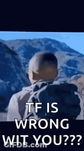 Man With Backpack Standing In Front Of Mountain GIF