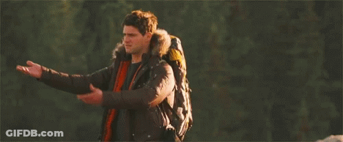 Man With Backpack Standing In Woods Arms Outstretched GIF