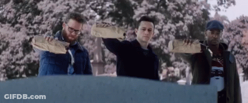 Man With Backpack Walking Past Home Sign In Hallway GIF