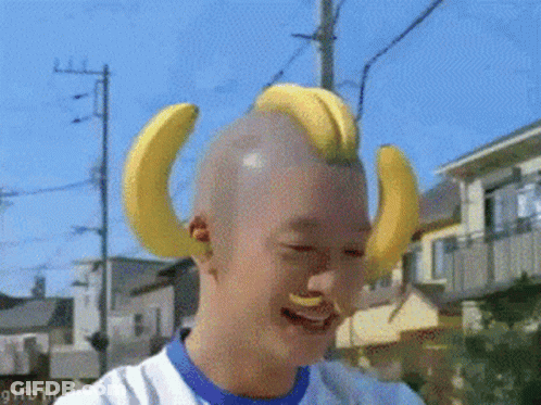 Man With Bananas On Head Smiling And Laughing GIF