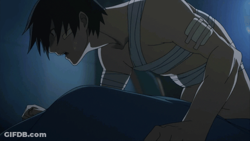Man With Bandage On Arm Laying On Floor GIF