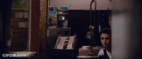 Man With Bandage On Arm Standing Next To Another Man GIF