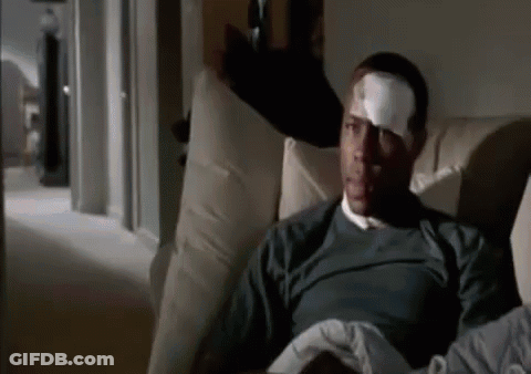 Man With Bandage On Forehead Sitting On Couch GIF