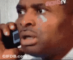 Man With Bandage On Forehead Talks On Cell Phone GIF