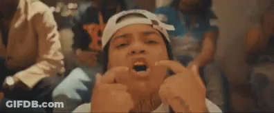 Man With Bandage On Head Making Funny Face Holding Fingers To Face GIF