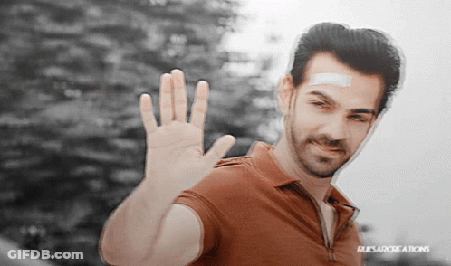 Man With Bandage Waving At Ruksarcreations Sign GIF