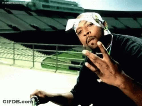 Man With Bandana Giving Middle Finger In Front Of Stadium GIF