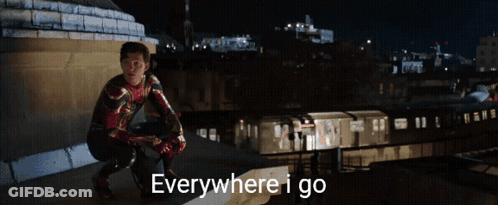 Man With Bandana Holding Another Man's Arm GIF