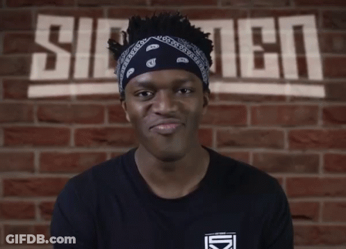 Man With Bandana In Front Of Silent Wall GIF