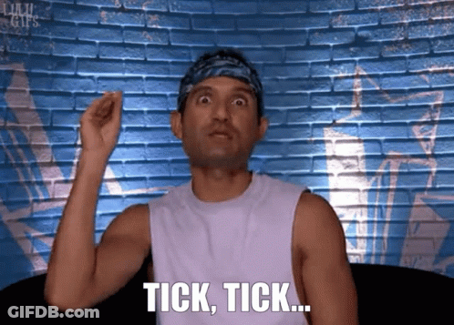 Man With Bandana Saying Tick Tick At Brick Wall GIF
