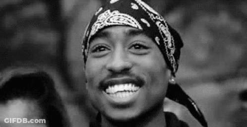 Man With Bandana Smiling In Black And White GIF