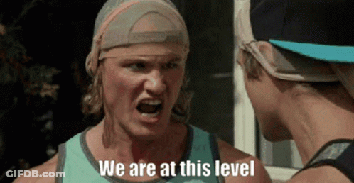 Man With Bandana Talking To Another Man GIF