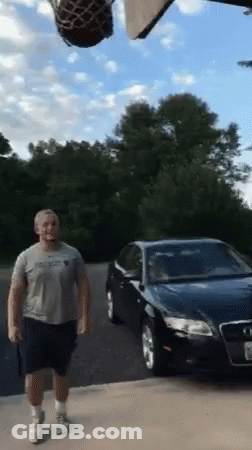 Man With Basketball In Front Of Car GIF