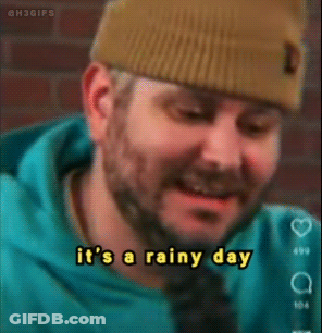 Man With Beanie And Blue Hoodie Says It's Rainy GIF