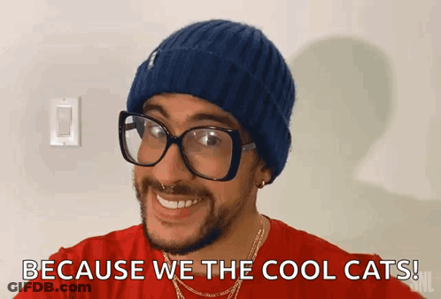 Man With Beanie And Glasses Smiling Says Because We The Cool Cats GIF