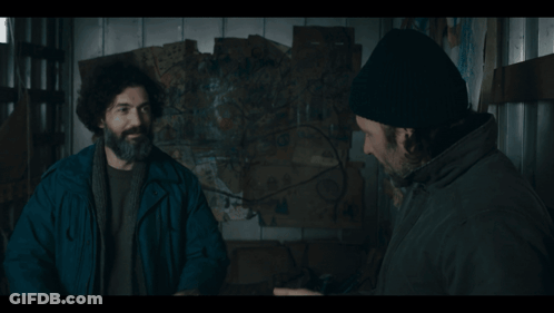 Man With Beard And Beanie Talking To Another Man GIF