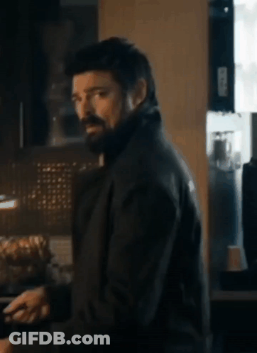 Man With Beard And Black Jacket In Kitchen GIF