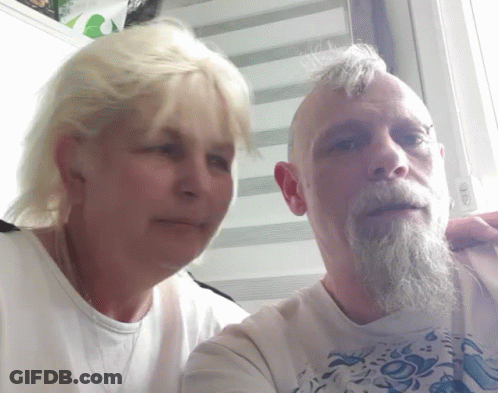 Man With Beard And Blonde Woman Posing GIF