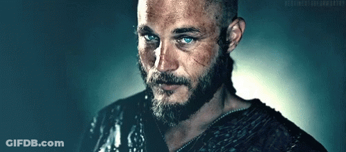 Man With Beard And Blue Eyes Next To Ponytail Man GIF