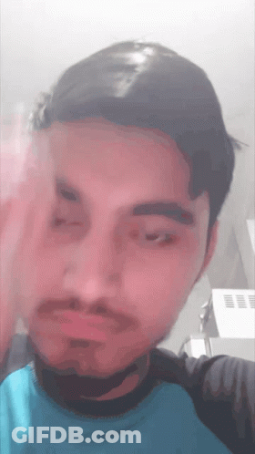 Man With Beard And Blue Shirt Making Face GIF