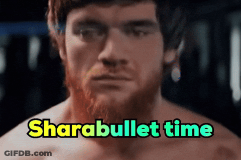 Man With Beard And Bun Sitting In Chair GIF
