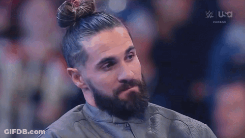Man With Beard And Bun Sitting In Chair GIF