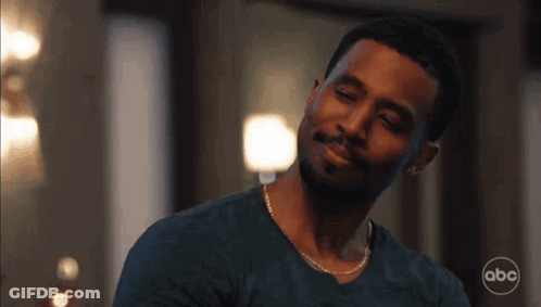 Man With Beard And Chain Smiling At Camera GIF